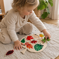 Child playing with the Bird Leaf Puzzle 8 Tree Species