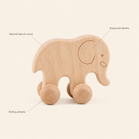 Elephant Push Toy on Wheels features: Natural beech wood, Rolling wheels, Engraved details