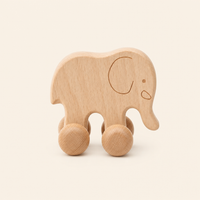 Montessori Elephant Push Toy on Wheels product photo on a cream background