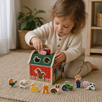 Child playing with the Farmhouse Shape Sorter