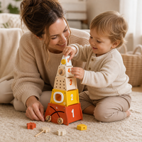 Parent and child playing together with the Rocket Stacking Tower 5 Pieces