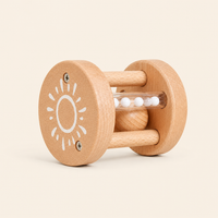 Montessori Sun Rattle Roller product photo on a cream background