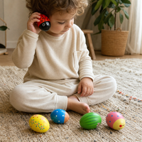 Child playing with the Wooden Musical Egg Shakers