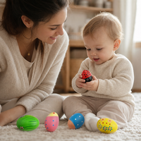 Parent and child playing together with the Wooden Musical Egg Shakers