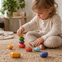 Child playing with the Wooden Stacking Stones 21 Pieces