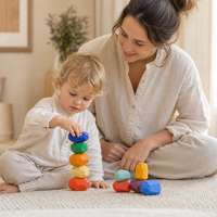 Parent and child playing together with the Wooden Stacking Stones 21 Pieces